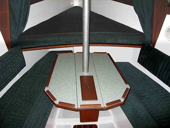 Dinette with drop leaf table. Bow V-berth.